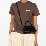 JACQUEMUS The long Chiquito leather bag.