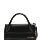 JACQUEMUS The long Chiquito leather bag.