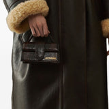 JACQUEMUS The Big Child Shoulder bag with flap.