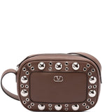 Valentino Garavani Nellcôte eyelet-embellished cross body bag
