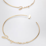 JACQUEMUS Gold hoop earrings with logo